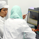 A Chinese engineer coaches a worker at the mobile phone factory in Assuit, Egypt September 30, 2018. Picture taken September 30, 2018.